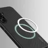 A black phone case with a magnetic ring is shown on a light gray background. Náhľad obrázku produktu