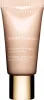 A close-up studio shot of a Clarins Instant Concealer tube with a gold cap. Produktbild-Vorschau