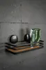 A bathroom shelf with toiletries mounted on a tiled wall. Produktbild-Vorschau