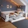 A child's bedroom with a daybed, shelves, and decorative elements. Anteprima dell’immagine prodotto