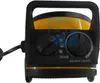 Close-up of the front panel of a yellow and black electric heater. Voir les images du produit