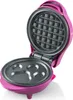 A pink mini waffle maker with the lid open, showing the top and bottom plates. Náhled obrázku produktu