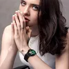 A woman wearing a smartwatch. Produktbild-Vorschau