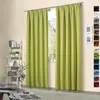 A living room setting with green curtains. Náhled obrázku produktu