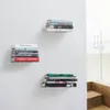 Three shelves mounted on a white wall, each holding a stack of books. Anteprima dell’immagine prodotto
