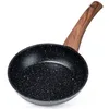 A black frying pan with a wooden handle is shown against a white background. Podgląd zdjęcia produktu