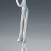 A close-up view of a white power cord with a plug, neatly wrapped and secured by blue clips to a white appliance handle. Náhled obrázku produktu