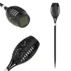 A solar-powered garden torch light is shown from multiple angles against a white background. Voir les images du produit