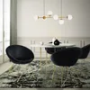A dining room scene with a round table and chairs. Produktbild-Vorschau