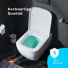 A modern white wall-mounted toilet with green water in the bowl, set against a dark gray wall. Includes marketing text and a warranty badge. Produktbild-Vorschau