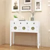 A white console table with brass hardware is displayed against a light beige wall, with framed artwork above. Anteprima dell’immagine prodotto