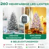 A split image showing a flocked Christmas tree with lights and a control box, and another flocked Christmas tree with colorful lights. Podgląd zdjęcia produktu