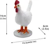 A white chicken figurine with red comb and orange feet, standing on a silver base. Dimensions are indicated with text and arrows. Podgląd zdjęcia produktu