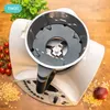 A close-up view of a food processor attachment with ingredients like tomatoes and grains scattered around it. Produktbild-Vorschau