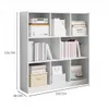 A white, multi-shelf bookcase filled with books and decorative boxes. Produktbild-Vorschau