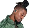 A man wearing headphones and a jacket. Produktbild-Vorschau