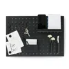 A black pegboard organizer with various items attached. Náhled obrázku produktu