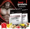 A muscular man in a red hoodie is featured alongside two bags of protein powder, with various food items like bananas, strawberries, chocolate, and coconut scattered around the bottom. Produktbild-Vorschau