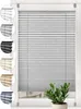 A product image showing a gray pleated blind with swatches of other colors on the left side, and a potted plant in the foreground. Produktbild-Vorschau