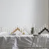A table set with Christmas candle arches and decorations. Podgląd zdjęcia produktu