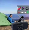 A man is sitting in a tent with a solar radio in the foreground, while a graphic overlay shows devices being charged. Produktbild-Vorschau