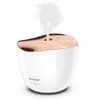 A white ultrasonic aroma diffuser with a rose gold top, emitting a stream of mist. Produktbild-Vorschau