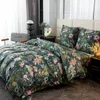 A neatly made bed with floral patterned bedding in a bedroom setting. Náhľad obrázku produktu