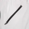 A close-up view of a white fabric with a black zipper pocket. Produktbild-Vorschau