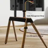 The back of a TV stand with cables managed by straps. Podgląd zdjęcia produktu
