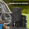 A black garden cart is shown in the bed of a pickup truck next to a bicycle. The background is blurred green grass and trees. Produktbild-Vorschau