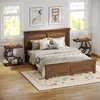 A bedroom scene with a bed, nightstands, and decor. Produktbild-Vorschau
