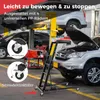 A product image showing a car creeper used in an auto repair shop setting. Podgląd zdjęcia produktu