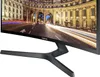 A close-up view of the bottom right corner of a curved Samsung monitor, showing the stand and part of the screen displaying a city street scene at night. Produktbild-Vorschau