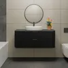 A modern black vanity with a white vessel sink and a round mirror above it, set against a tiled wall. Náhled obrázku produktu