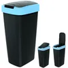 A black trash can with a blue rim and lid, shown in three different views: closed, partially open, and fully open. The main image shows the trash can closed, with two smaller images to the right showing it open. Produktbild-Vorschau