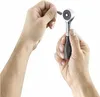 Hands holding a ratchet and a bit. Voir les images du produit