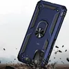 A blue phone case with a ring holder is shown in a dynamic pose, appearing to be dropped onto a rocky surface. Produktbild-Vorschau