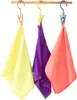 Three small towels in different colors (yellow, purple, orange) are hanging from hooks on a wooden rod. Anteprima dell’immagine prodotto