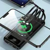 A black wireless power bank with multiple integrated charging cables and a phone being charged wirelessly. Produktbild-Vorschau