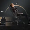 A man is shown relaxing in a gaming chair, demonstrating its reclining capabilities. Produktbild-Vorschau