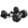 A pair of adjustable dumbbells on a stand. Produktbild-Vorschau