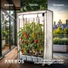 A collage showing a greenhouse in different outdoor settings: a balcony, a garden, and a terrace with a city skyline. The greenhouse contains pepper plants with ripe peppers. Produktbild-Vorschau
