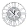 A decorative wall clock with Roman numerals and a starburst design. Anteprima dell’immagine prodotto