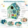 Drewniany domek do zabawy z grami sensorycznymi i schowkami Podgląd zdjęcia produktu 5