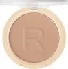 A close-up, top-down view of a pressed powder compact with the brand's initial 'R' embossed on the powder. Anteprima dell’immagine prodotto