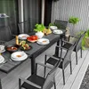 An outdoor dining set with a table and chairs on a wooden deck. Náhled obrázku produktu