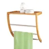 A bamboo and metal towel rack with a green towel hanging on it, and two toiletries on the top shelf. Náhled obrázku produktu