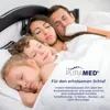 A family sleeping soundly in bed, covered by white sheets. Produktbild-Vorschau