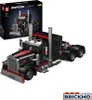 A model of a black and red semi-truck with flames on the hood, next to its packaging box. Anteprima dell’immagine prodotto