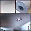 A collage showing a close-up of fabric texture, a roll of fabric, and the interior of a car ceiling with a light fixture. Produktbild-Vorschau